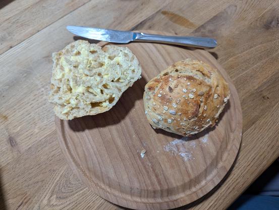 One and a half buns. They are soft on the inside, still warm and have a good crust.