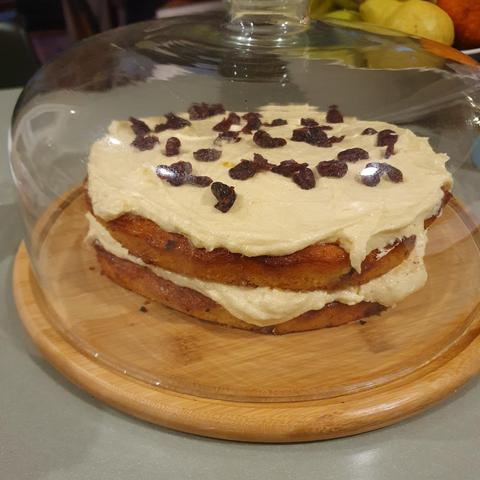 yoghurt and cranberry cake with lemon buttercream icing, in a fancy glass cloche that I bought off Temu.