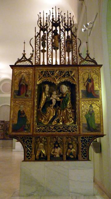 Carved altar reredos depicting St Anne, the Virgin, and baby Jesus