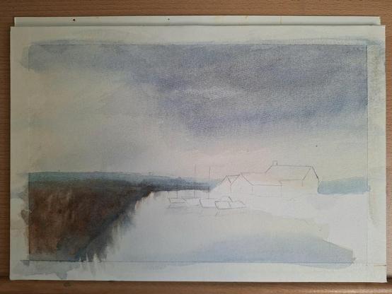 A partial painting showing my watercolor interpretation of Edward Seago's Norfolk Boatyard oil painting. The work is only partially finished with a moody sky of contrasting dark grey-blue's and dull yellow ochre, soft blue hills in the distance, and a grassy marsh field on the left painted in. On the right, unpainted sketches of boats in the harbor, three buildings (mostly seen by their rooftops), and an unpainted field running alongside the harbor water are waiting to be finished. This project was done alongside a video from artist Robert Mee conducting the same practice study.