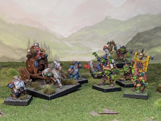 A dwarf cart accompanied by a mage and warrior find themselves facing four goblin raiders and a Shaman