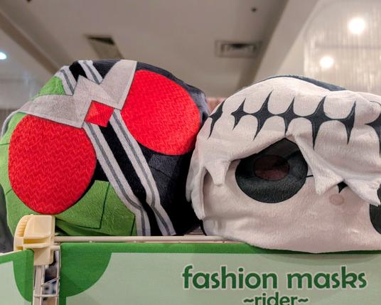 two giant squishy plush beans of Kamen rider double and skully j graves atop the pocket toku booth