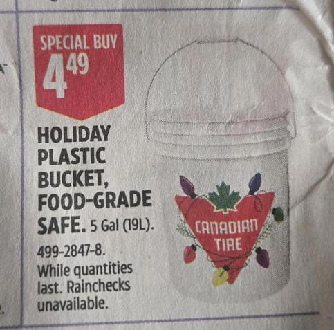 Photo of the current Canadian Tire flyer showing the 5 Gal (19L) version of the white bucket with the Canadian Tire logo. Wrapped around the logo are multi-coloured Christmas lights.
Text says: Special Buy $4.49. Holiday plastic bucket, food-grade safe. 5 Gal (19L) 499-2847-8. While quantities last. Rainchecks unavailable.