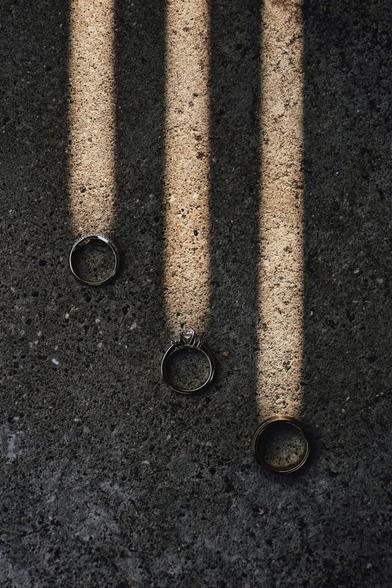 Powerful rings on asphalt each seeming to emit columns of light