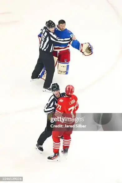 NEW YORK, NEW YORK - NOVEMBER 16: Jonathan Quick #32 of the New York Rangers exchanges words with Dylan Larkin #71 of the Detroit Red Wings after the final whistle at Madison Square Garden on November 16, 2025 in New York City. (Photo by Jared Silber/NHLI via Getty Images)