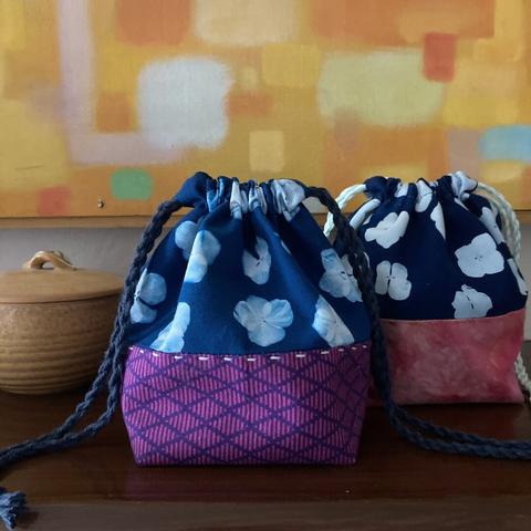 square bottomed handmade draw string bags made with fabric printed with cyanotype.