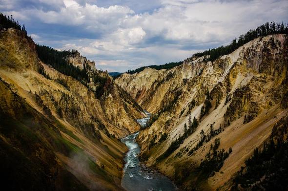 Taken from the Lower Falls, the colours are spectacular.  They come from the numerous hot springs leaching minerals such as sulfer onto the cliff walls.  Rising steam betrays the presence of a hot spring on the lower left.