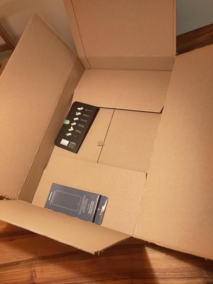 A huge box containing two very small items delivered by Galaxus/Digitec