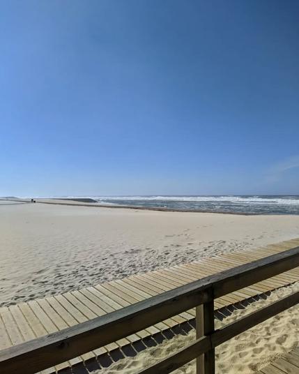 sunny day at the beach, but with a wild sea