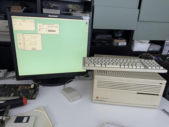 The monitor hooked up to a Macintosh IIcx, showing the control panel revealing it is running at 1280x1024