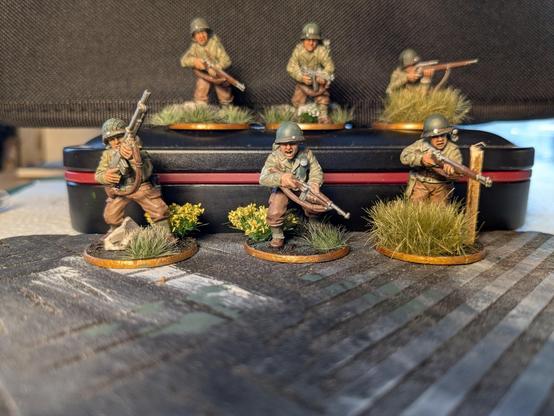 A set of painted bolt action miniatures, depicting WWII era US Rangers. They are painted to resemble the cast from the film' "Saving Private Ryan"