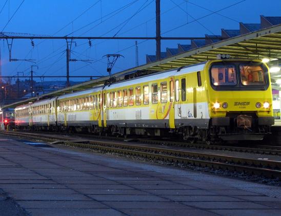 Deux rames Z 11500 de la SNCF en gare de Luxembourg. Elles arborent la livrée Mirabelle avec les faces jaunes et un large bandeau de la même couleur autour des fenêtres et de même que les portes d'accès. Le soir de novembre tombe et nous offre une belle heure bleue.

Two SNCF Z 11500 EMUs at Luxembourg station. They feature the Mirabelle livery with yellow faces and a wide headband of the same color around the windows and as well as the access doors. November evening falls and offers us a beautiful blue hour.