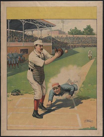 A vibrant illustration depicting a moment from a baseball game, with detailed figures and an animated crowd in the background. A catcher is poised to catch a ball while another player slides into home base as two onlookers watch closely.
The image showcases classic sports attire of early 20th-century baseball players, complete with protective gear like leg guards. The colors are vivid, contrasting reds against greens and whites within the field setting.