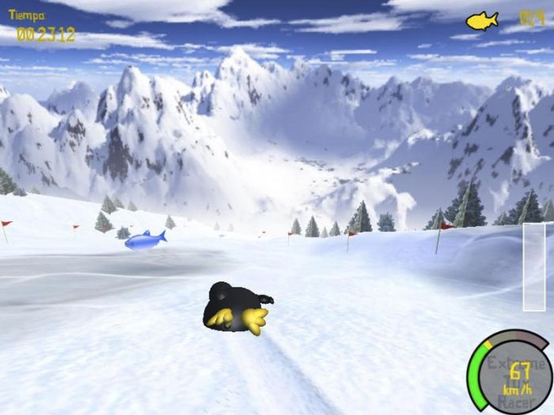 A screenshot of Tux Racer, featuring Tux Penguin, the mascot of Linux, sliding belly-first down a snowy mountain ski course, leaning towards a fish positioned on the course slope.