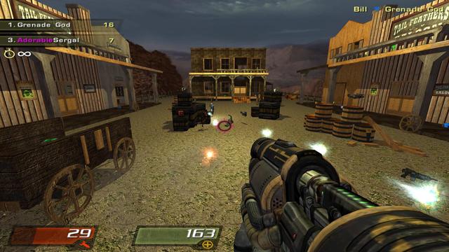 A screenshot from Quake 4 of a wild west-style map complete with saloons, wagon carts, and wine barrels scattered around a central arena. The player is exchanging rocket fire with an opponent.