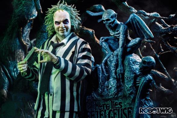 Beetlejuice files his nails stood next to his gravestone