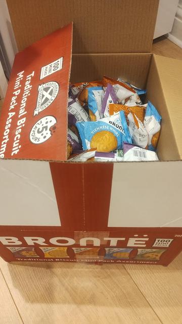 A box marked "BRONTE", filled with small packets of biscuits