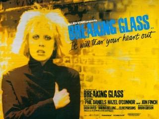 Theatrical release poster for the film Breaking Glass with the tag line “It will tear your heart out “ and featuring a young woman dressed in black with a shock of bleached hair and heavy eye makeup