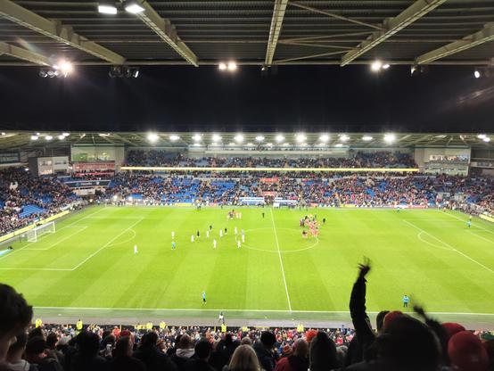 The players on the pitch after the final whistle at the Cardiff City Stadium