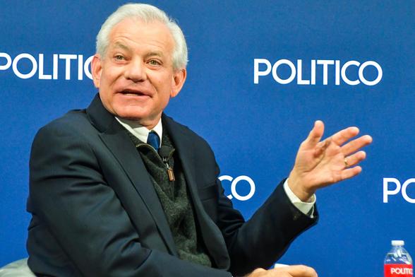 Photo of interview with Rep. David Schweikert (R-AZ) before a Politico backdrop.