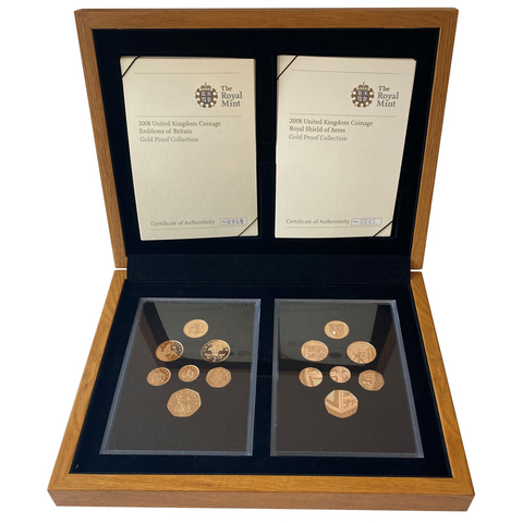 2008 UK gold proof set showing two sets of the coins, one showing each side and with the distinctive shield design visible in the coins as a set, presented in a wooden box