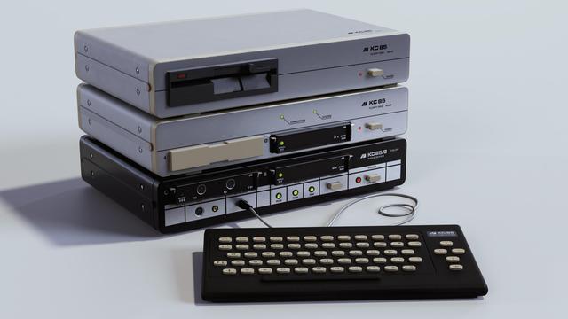 Another photorealistic rendering of the KC 85/3 computer with keyboard, floppy controller and floppy drive on a white background.