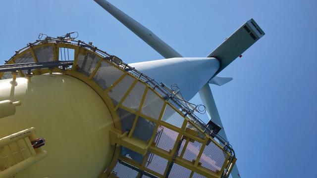 Detailed close‑up of the underside of a large offshore wind turbine, illustrating the scale of renewable energy infrastructure central to Wales’ offshore wind ambitions.