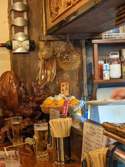 Pufferfish in the corner of a wooden bar