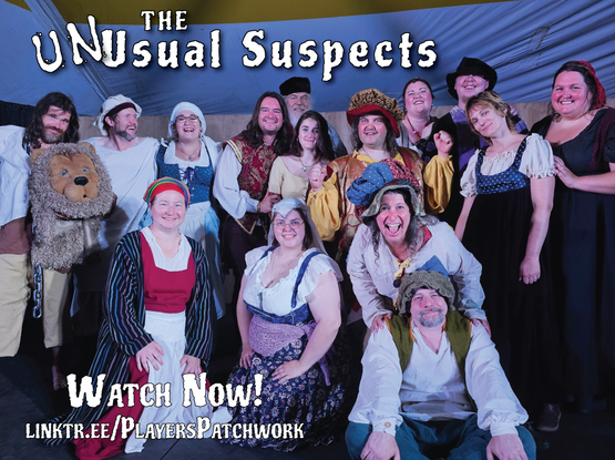 A group of actors pose for a cast shot after performing a commedia dell'arte play.