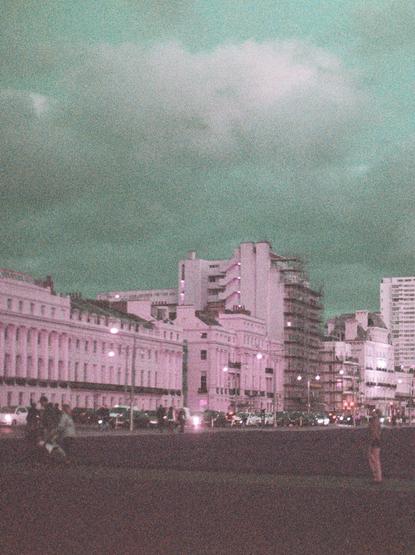 The centre of the frame has Embassy Court, surrounded by the other buildings, all hued purple, and the sky is turquoise