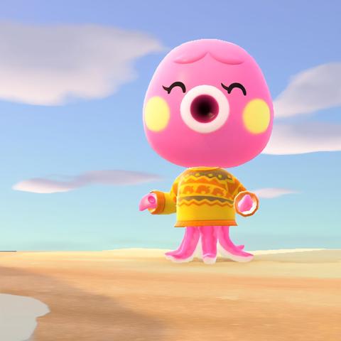 Animal Crossing: New Horizons screenshot. Image shows a smiling Marina (pink octopus) on the beach in a yellow sweater with orange Nook leaves across the center. It is designed to look like a yellow holiday "ugly" sweater with orange, brownish, striping.