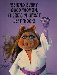 Miss Piggy from the muppets in a karate gi, "Behind every good woman, there's a great left hook"