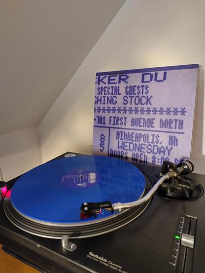 Photo of a turntable playing Minnesota Miracle by Hüsker Dü, record one of the 1985: The Miracle Year box.