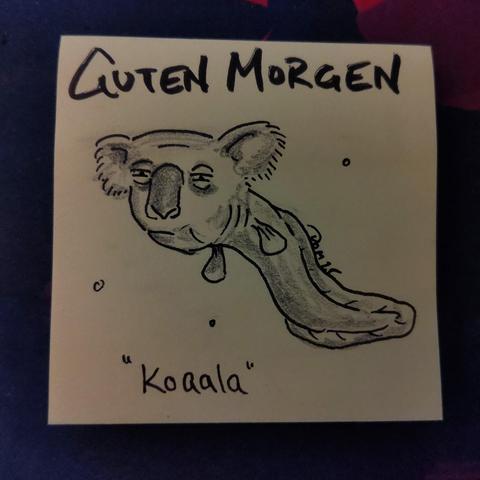 Auf einer gelben Haftnotiz steht "guten morgen"
Darunter ist ein hybrid Koala Kopf und Aal Körper abgebildet - ein Koaala...