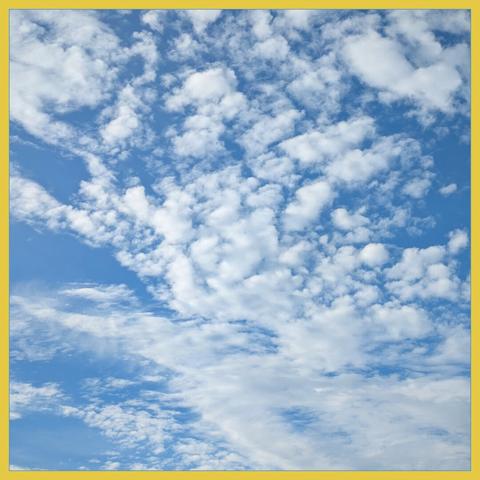 blue sky with friendly white clouds