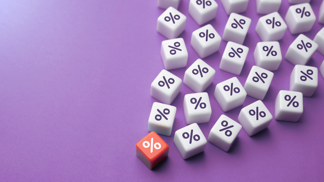 Beeld: verschillende witte blokjes en 1 rood blokje met een %-teken.