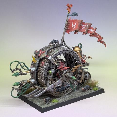 A Skaven Doomwheel. A large metal and wood wheel with spikes at the front and a rat pilot
