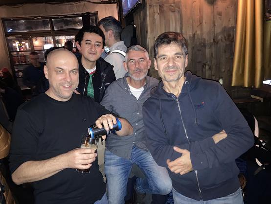 Socializing at the pub after the talks