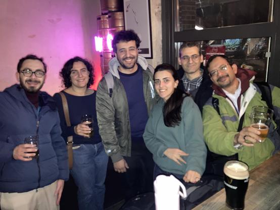 Socializing at the pub after the talks