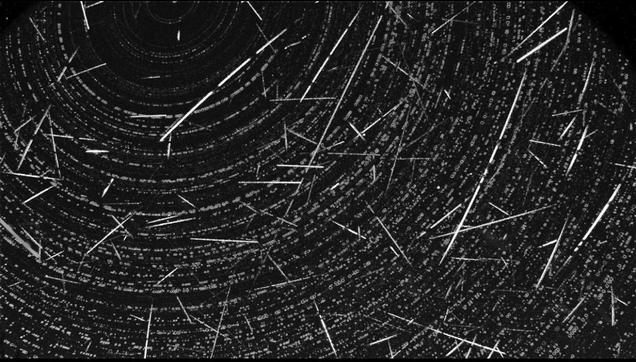 Stack of 103 meteor tracks (straight lines) from one camera (US001J). Concentric circles are incompletely removed star trails centered around Polaris.