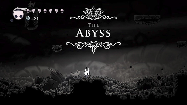 capture d'écran du jeu vidéo Hollow Knight, avec le petit bonhomme au fond d'un trou noir & blanc & un cartouche de localisation géant THE ABYSS