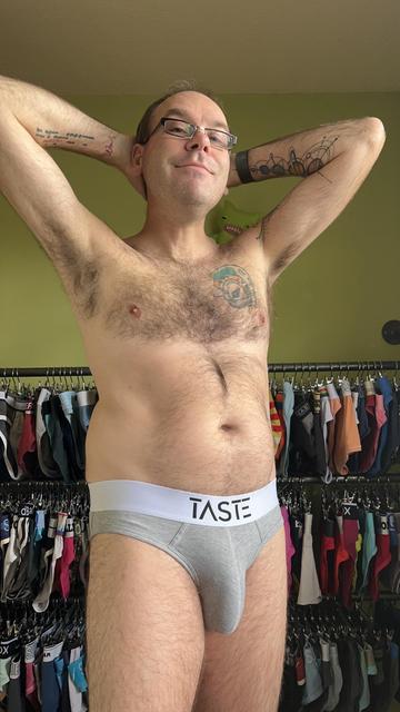Hairy gay guy wearing grey Taste briefs with white waistband