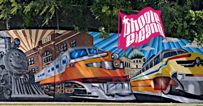 A mural of a steam locomotive train engine and two diesel train engines at South 6th Street and Oklahoma Avenue in Milwaukee, Wisconsin, USA, created by Natacho Lopez and his brothers. This mural pays tribute to fallen City of Milwaukee Department of Neighborhood Services code inspector Greg "Ziggy" Zyszkiewicz and features a black and white photograph from 1948 of the same location, which was then an overpass for the North Shore Line electric train route.