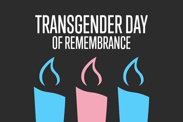 A image of three candles, one pink candle surrounded by two blue candles.  

The text above the candles says Transgender Day of Remembrance.