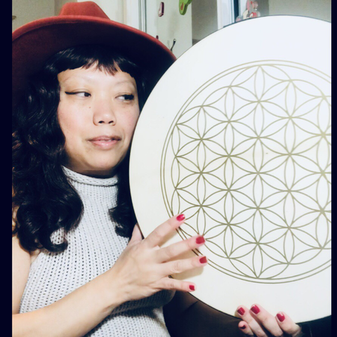 Crissy gazing in love with her flower of life drum v.2