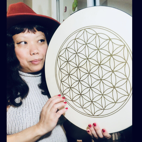 Crissy gazing in love with her flower of life drum v.3