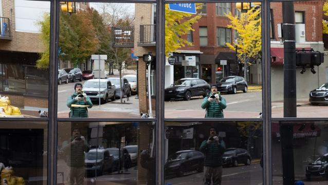 A self portrait shot through 8 different window panes resulting in different angles of the photographer.