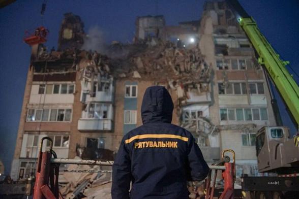 Rescuers work at the site of the Russian strike on the residential multi-story building, fall 2025 in Ternopil, Ukraine