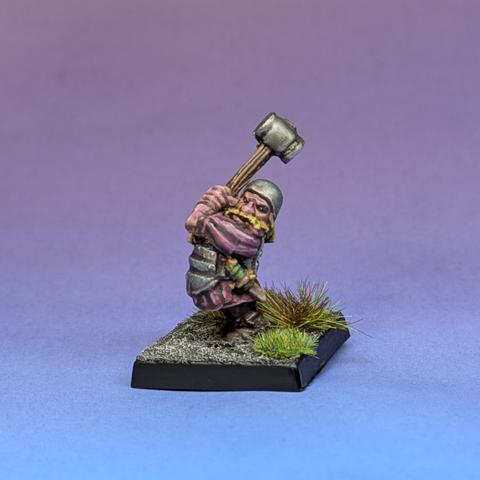Dwarf holding a hammer aloft in two hands
