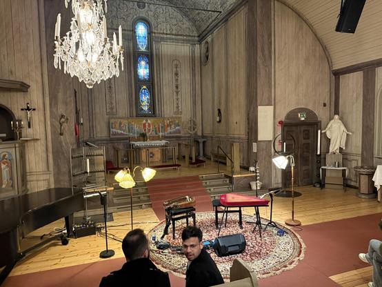 Photo of two instruments on an empty stage.
